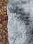 A plush gray icelandic sheepskin coat sleeve with long wool icelandic texture and natural soft pile