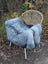 Gray faux fur throw draped over wicker chair featuring long wool icelandic natural grey sheepskin texture