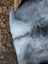 A soft grayish-blue massive icelandic sheepskin blanket with natural long wool icelandic texture measuring 53 by 32 inches