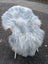 Fluffy white and grey icelandic sheepskin chair with wooden armrests featuring long wool icelandic sheepskins