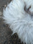 Fluffy white wool icelandic sheepskin with dark strands in the long wool grey icelandic sheepskin ice75 56 x 35