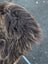 Back side of a massive natural bronze icelandic sheepskin with a fluffy dark rusty icelandic long wool tail visible