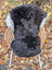 Black ice67 43 x 28 wool icelandic sheepskin chair cover with white fur trim and dark edges