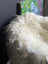 A plush off-white icelandic sheepskin throw with long curly natural wool fibers perfect for cozy decor