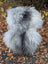 Fluffy natural grey icelandic sheepskin rug with long wool draped over a chair for cozy decor