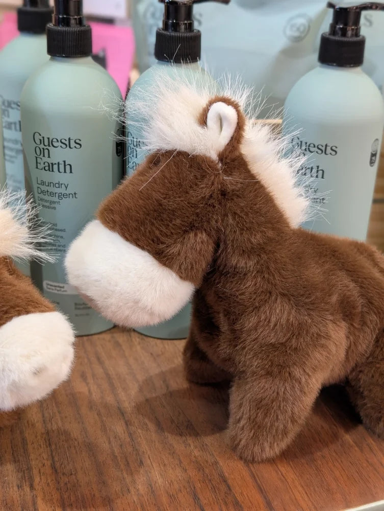 A large size plush horse toy named Jorge the Pony with soft fuzzy brown and white fur perfect for cuddling