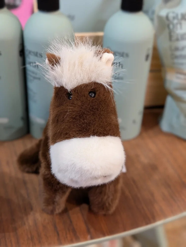 A large size plush brown and white horse toy named jorge the pony with a fluffy mane perfect for cuddling