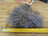 Grey curly fur mushroom sheepskin pom with white string