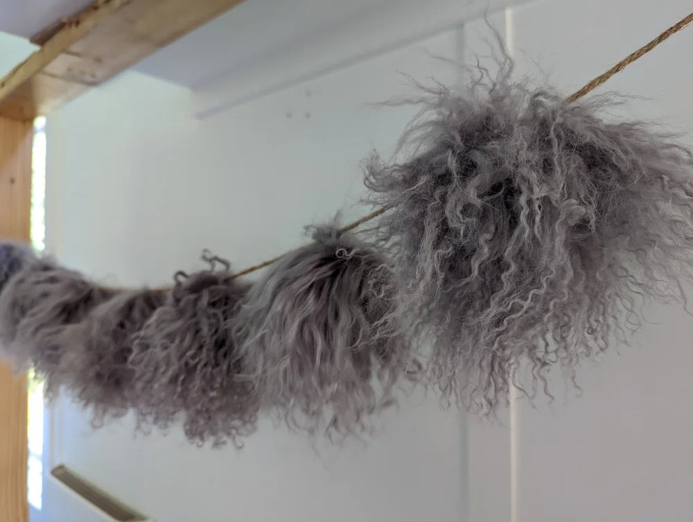 Gray fluffy feather boa in mushroom sheepskin pom poms