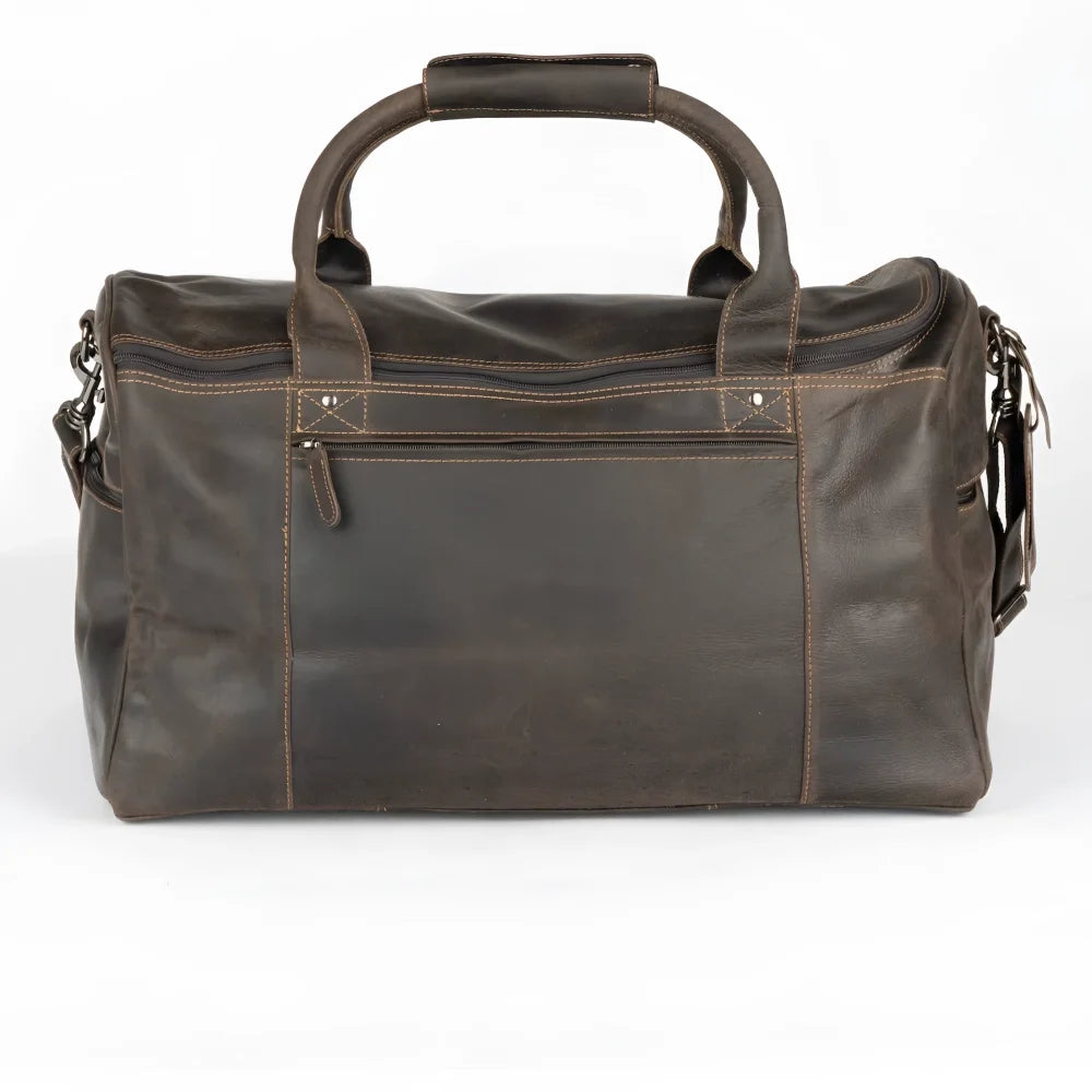 Dark brown leather weekender bag with large main compartment and vintage look