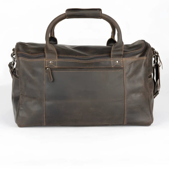 Dark brown leather weekender bag with large main compartment and vintage look