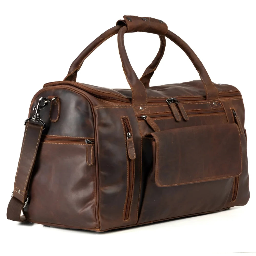 Brown leather weekender bag with large main compartment and sturdy handles