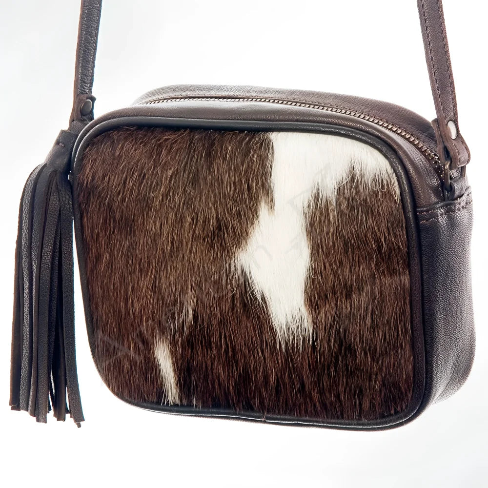 Brown and white real hair-on cowhide crossbody bag with dark leather tassel strap