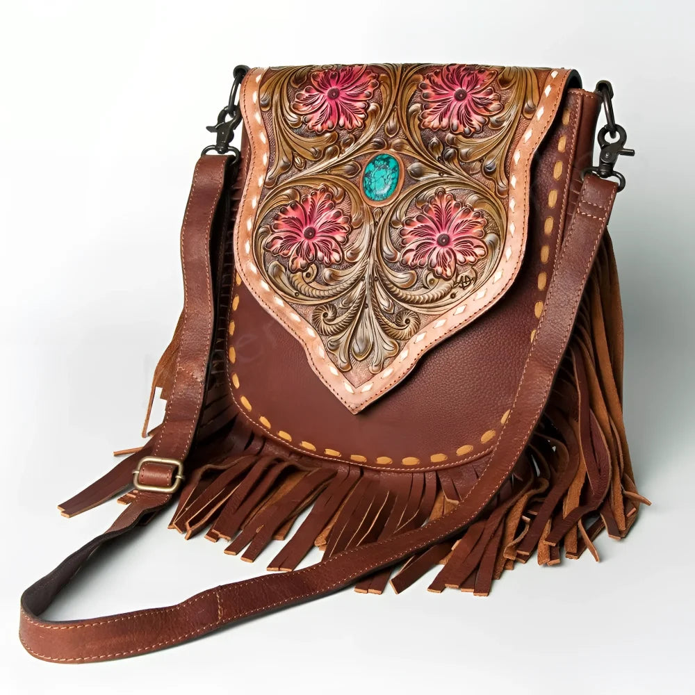 Hand-tooled floral full-grain leather messenger bag with pink flowers, turquoise stone, fringe
