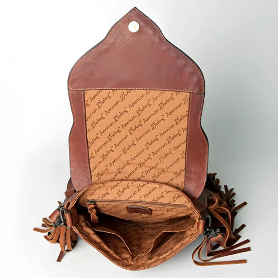 Hand-tooled floral full-grain leather fringe messenger bag with American Daring branding