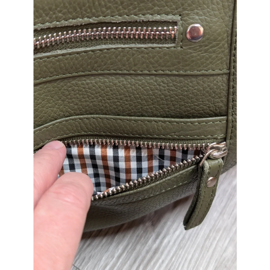 Olive green leather crossbody bag with textured faux leather and gingham lining