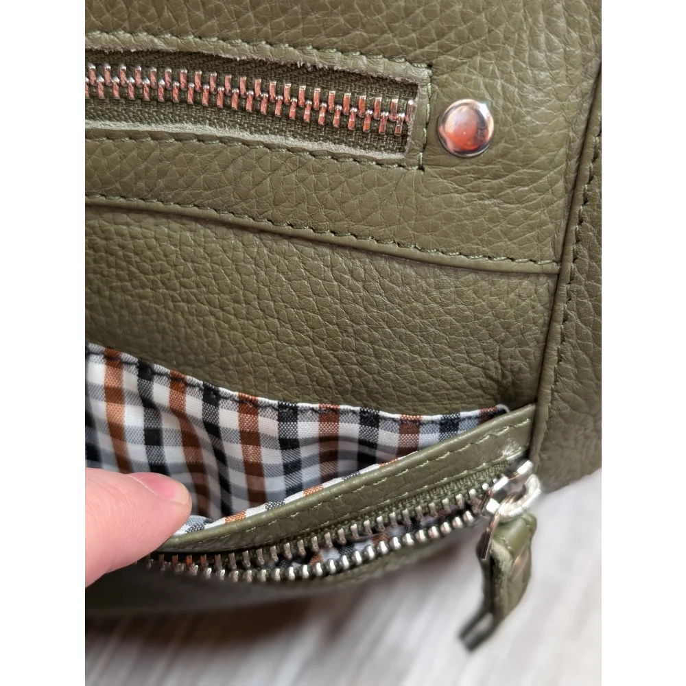 Olive green leather crossbody bag with copper zipper and checkered lining