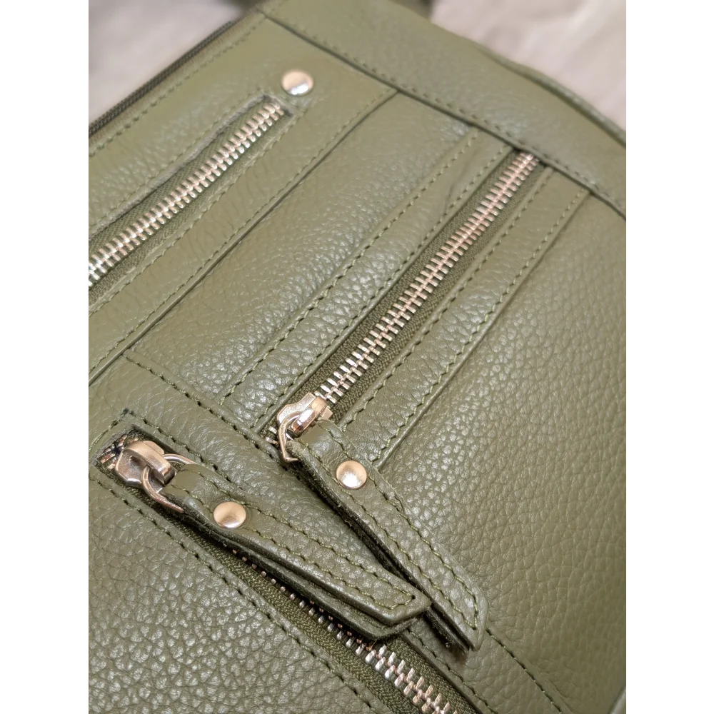 Olive green leather crossbody bag with textured leather and silver zippers