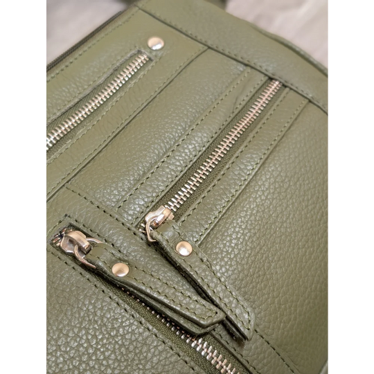 Olive green leather crossbody bag with textured leather and silver zippers