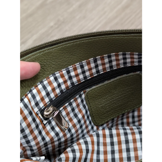 Olive green leather crossbody bag with checkered interior lining