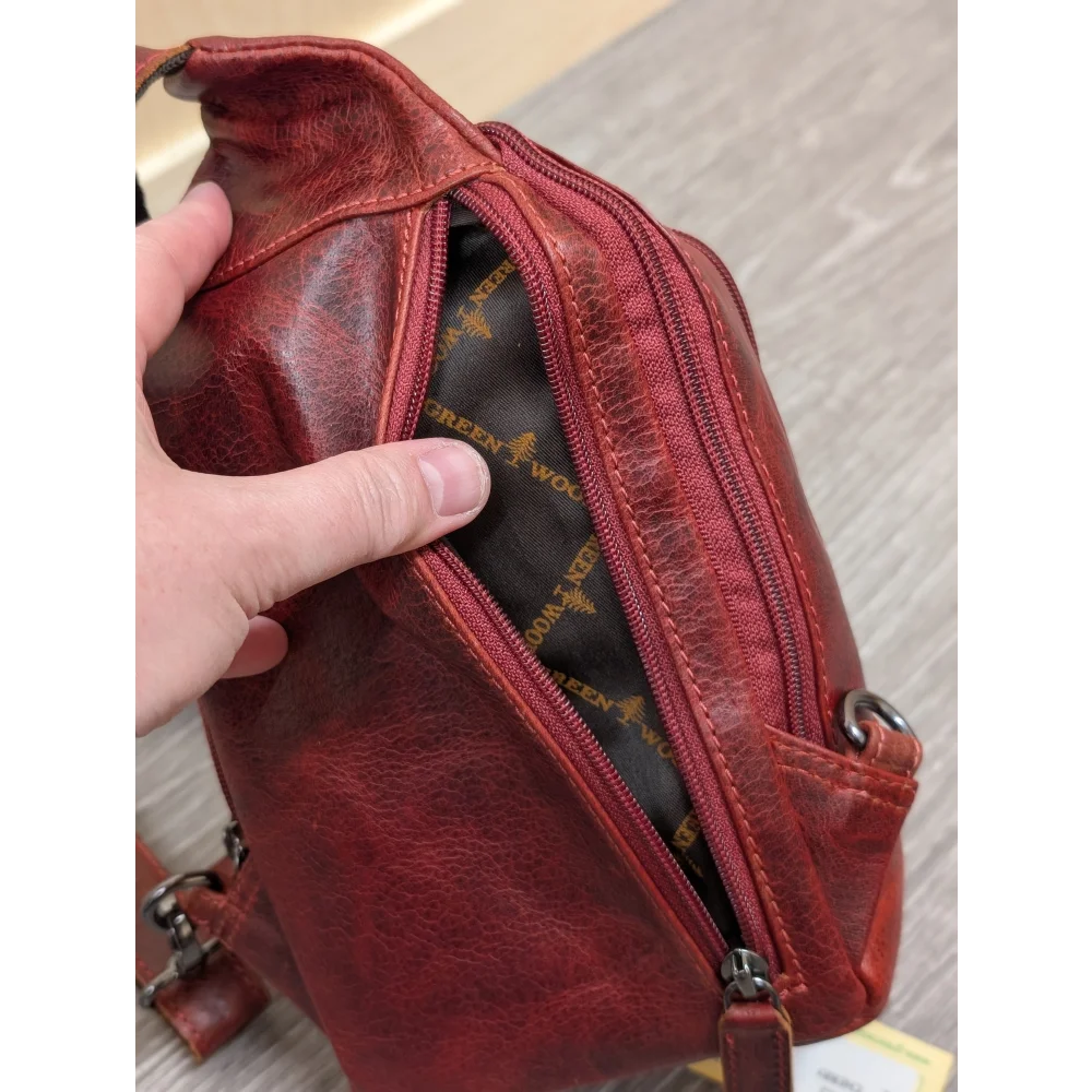 Red wax pull-up leather Ajax sling bag with textured surface and stitching