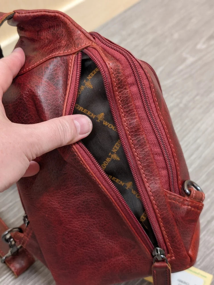 Red wax pull-up leather Ajax sling bag with textured surface and stitching