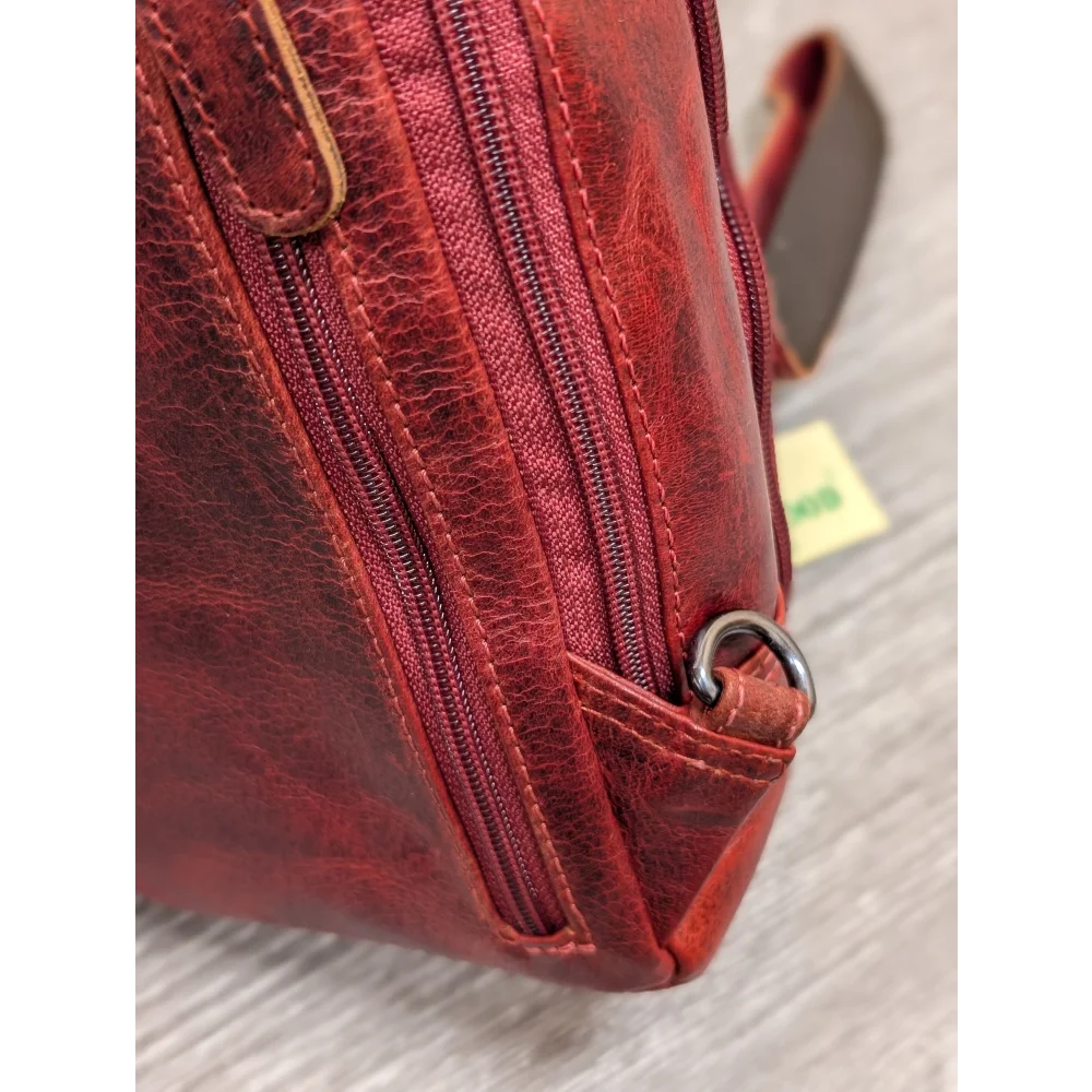 Red Ajax sling bag in textured wax pull-up leather with stitching