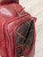 Red Ajax sling bag in wax pull-up leather with green + wood gold lining