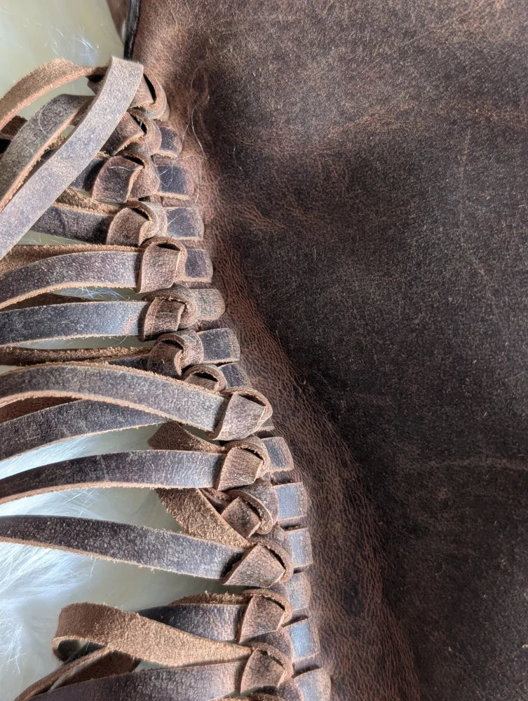 Brown leather braided strap detail on Mojave tassel bag