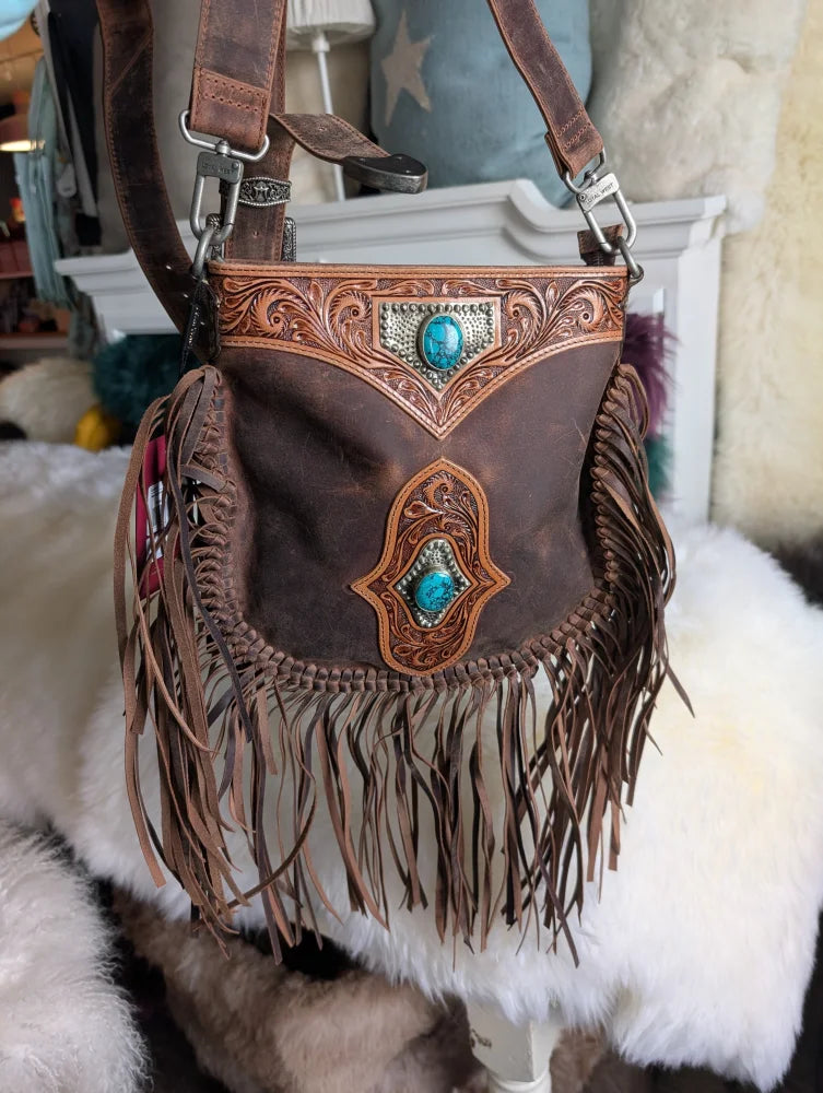Mojave tassel bag in hunter leather with turquoise accents, fringe