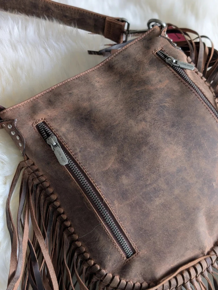 Mojave tassel bag in hunter leather with fringes and stitching