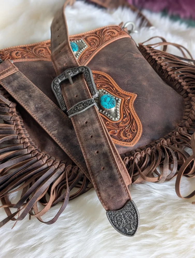 Mojave tassel bag in hunter leather with fringe, floral tooling, turquoise stones
