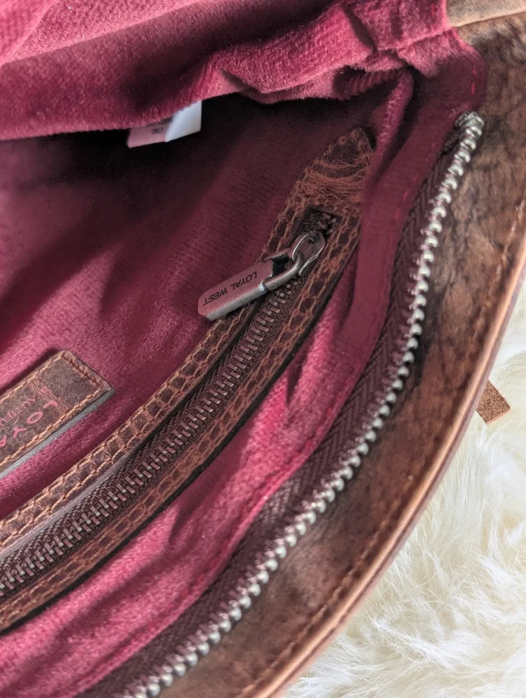 Mojave tassel bag in hunter leather with burgundy velvet lining