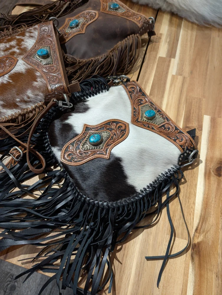 Cowhide mojave tassel bag with flowing fringe, rich hunter leather accents, and turquoise stone embellishments free over 500