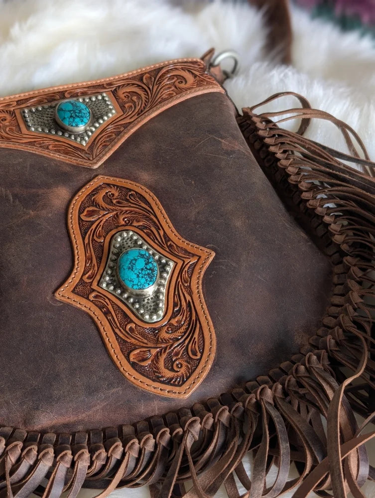 Mojave tassel bag in hunter leather with turquoise stones and fringe