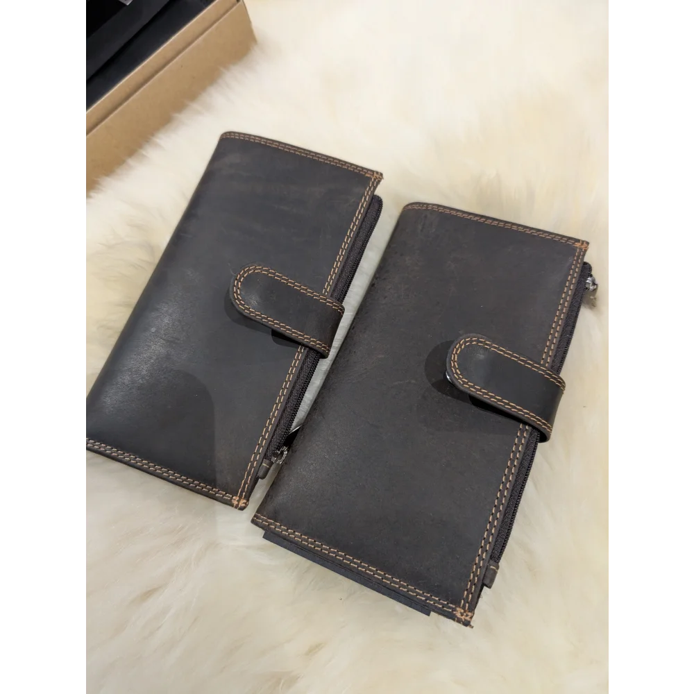 Dark brown leather wallet with silver hardware and Angus Oliver sheepskin stitching
