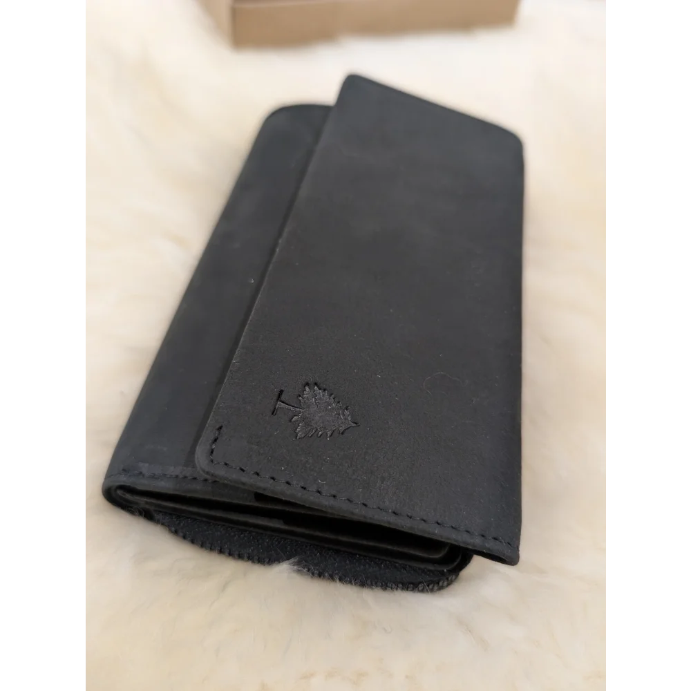 Soft black leather wallet with Angus Oliver sheepskin maple leaf design