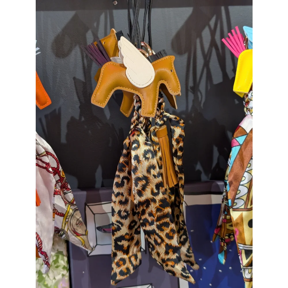 Light brown horse keychain with printed scarf by Angus Oliver