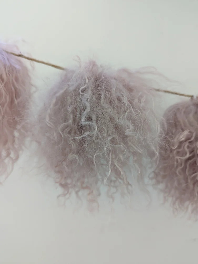 Light pink sheepskin pom pom with lavender curly feather garland