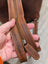 Brown leather shoulder bag strap with tan stitching on Leather Backpack GW006B