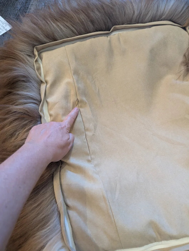 Cozy beige highland sheepskin pet bed with fur texture and zipper