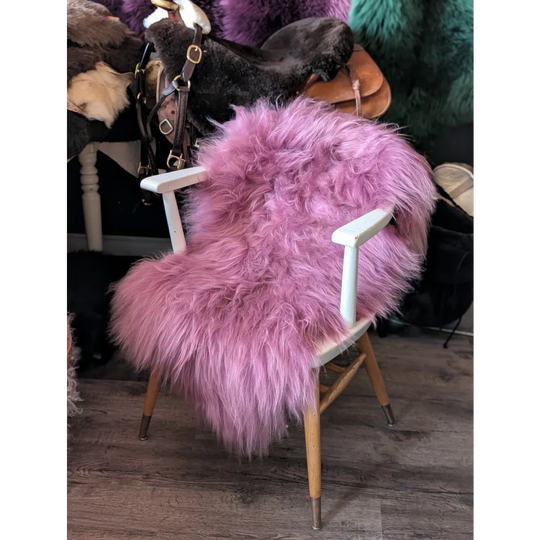 Pink Icelandic sheepskin fur chair cover with wooden legs