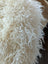Plush off-white icelandic sheepskins with long wool curly fleece and soft voluminous texture perfect for cozy use
