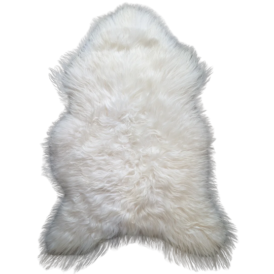 Natural white icelandic sheepskin rug with soft dense fur and irregular shape perfect for cozy decor