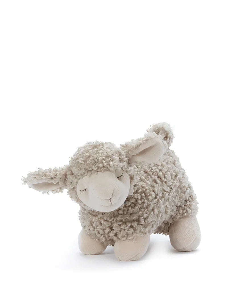 A soft cream-colored plush lamb named lucy with curly wool and closed eyes perfect for cuddling