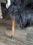 Large luv34 black faux fur chair with wooden legs and brass feet featuring soft wool icelandic sheepskin cover