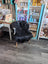 Black fluffy icelandic sheepskin chair with light wooden legs featuring long wool icelandic softness