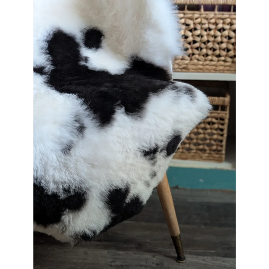 Luv4 large 43x31 inch black and white cow print faux fur chair cover inspired by spotted icelandic sheepskin rug
