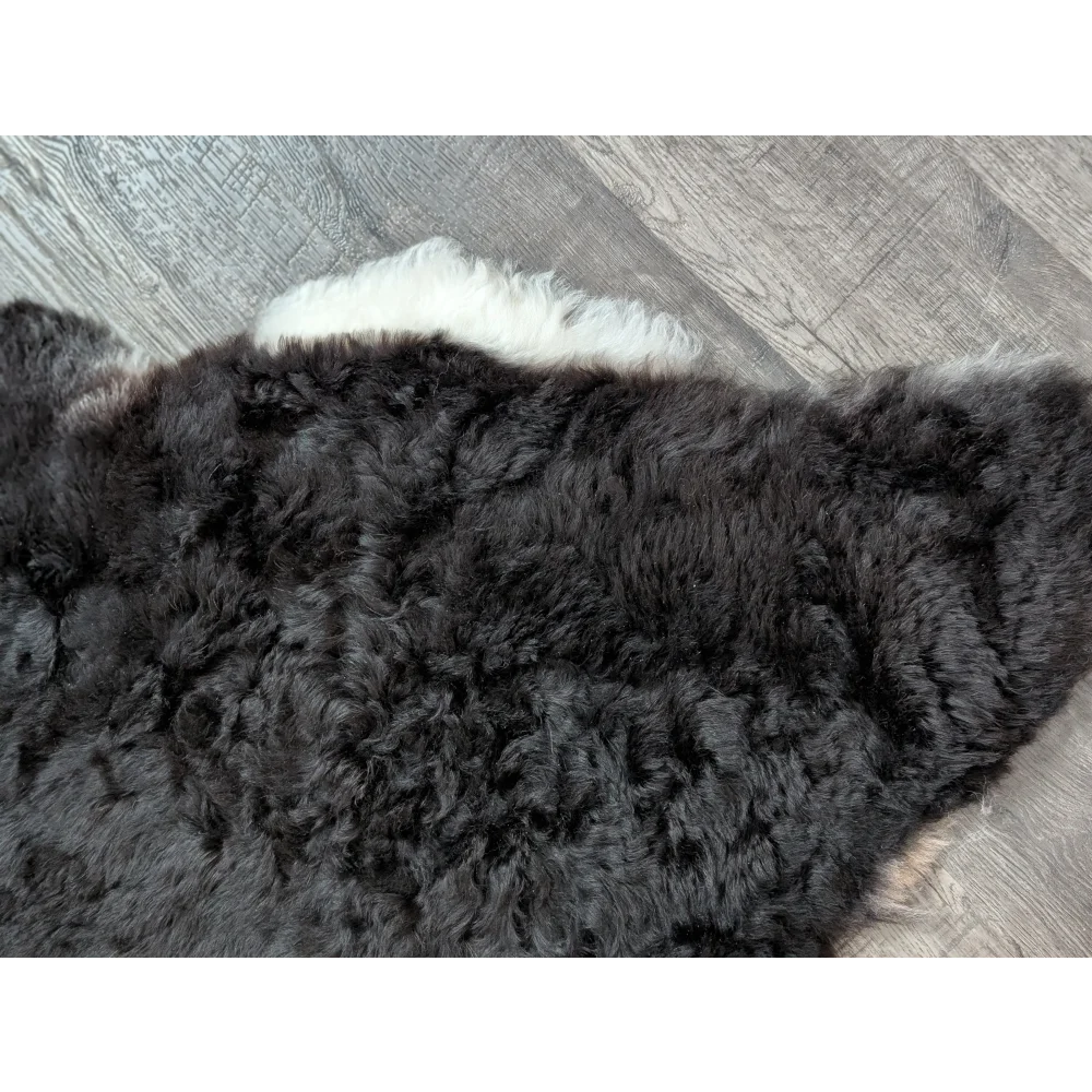 Large luv7 black icy icelandic sheepskin rug with short wool and white fluffy edge for cozy decor