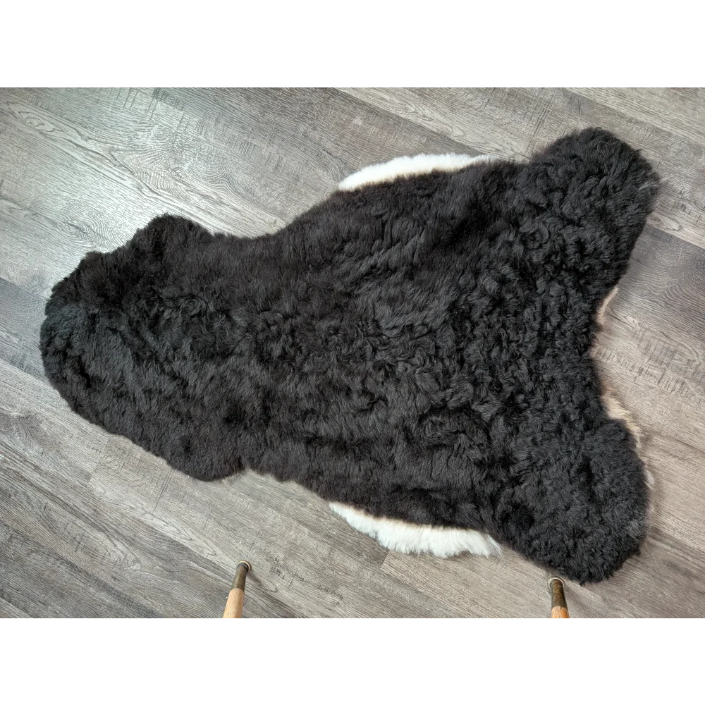 Black and white large soft luv8 icelandic sheepskin rug with curly plush short wool fur, 42 by 28 inches
